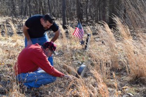 Tim and Slim studying tombstones. (Slim is in orange.)